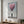 Colorful glass wall art featuring blooming heart design, romantic urban theme, by Artdesigna for modern interior decoration.