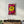 Colorful glass wall art featuring a peace love and smile graffiti design by Artdesigna, mounted on a wall.