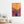 Glass wall art titled Peace Rising – Sunset Freedom by Artdesigna featuring vibrant sunset colors and abstract design on clear glass