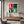 Love Blocks retro kare typography art glass wall art by Artdesigna featuring bold, colorful love-themed lettering on a clear glass panel.