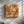 Handmade wooden wall art featuring a geometric square design crafted from olive wood by Artdesigna.